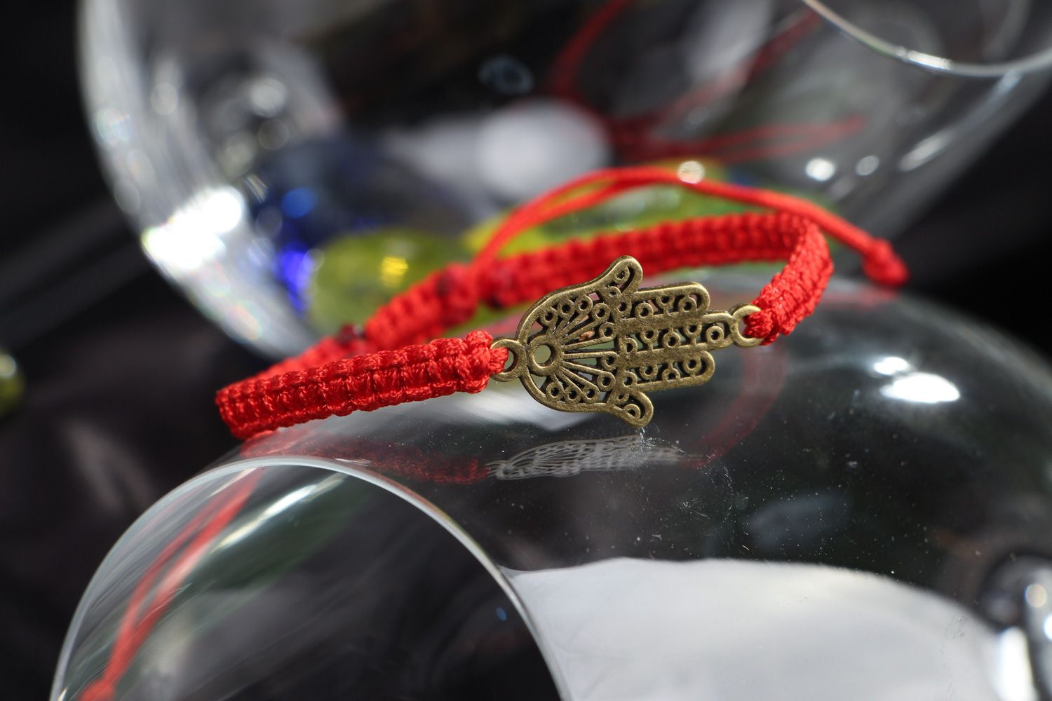 Thin handmade wrist friendship bracelet of red color with metal charm unisex photo 4