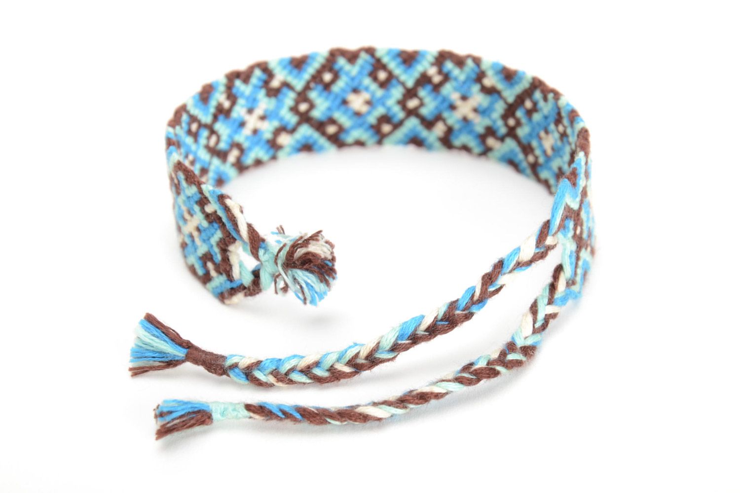 Handmade friendship wrist bracelet woven of threads with blue and brown ornament photo 3
