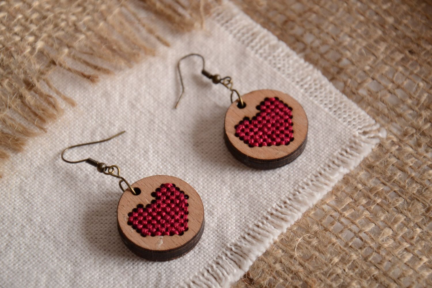 Handmade round plywood earrings with cross-stitch embroidery Red Hearts photo 1