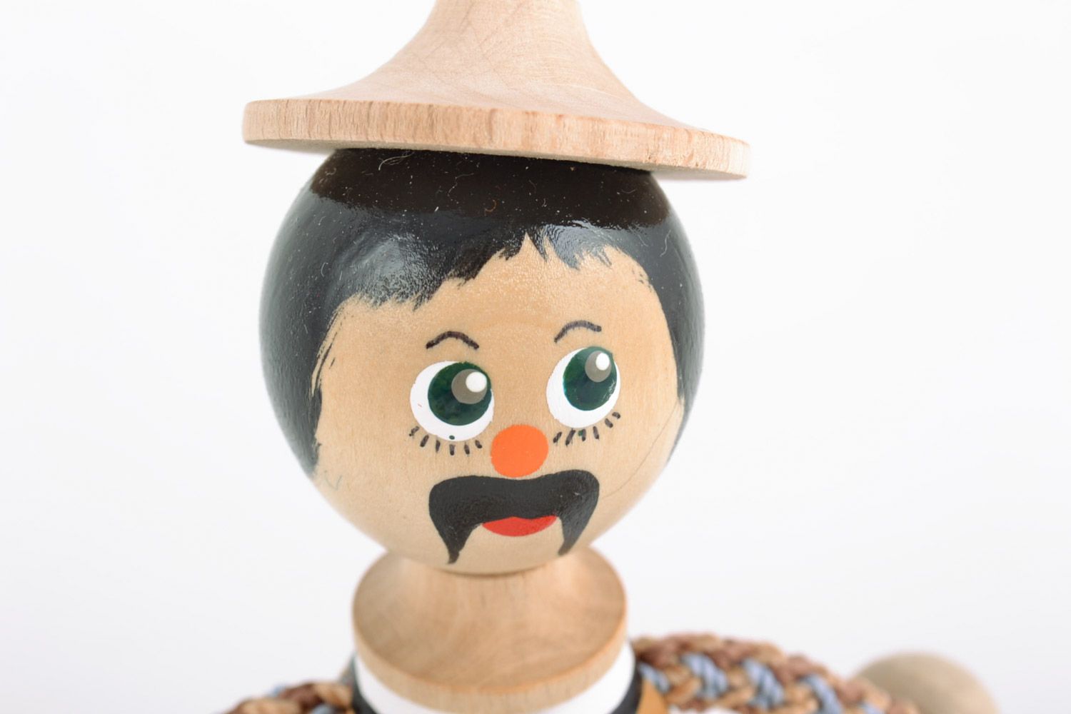 Handmade painted wooden eco toy in the shape of boy in national Ukrainian costume photo 3