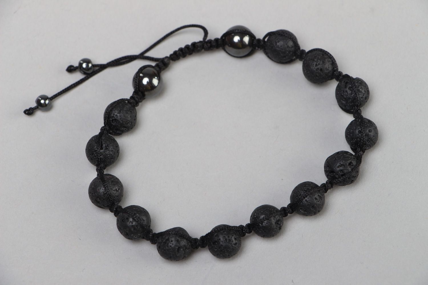 Handmade wrist bracelet with volcanic lava and hematite beads with adjustable size photo 2