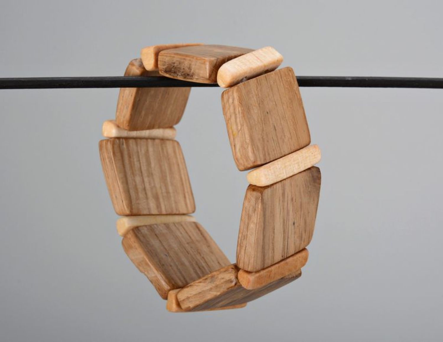Brown wooden bracelet on elastic band photo 4