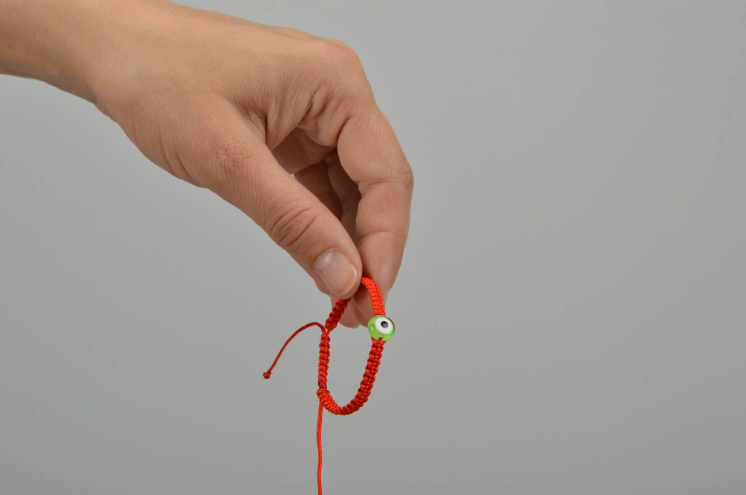 Плетеный детский браслет на руку ручной работы из вощеной нити Зеленый глаз фото 5