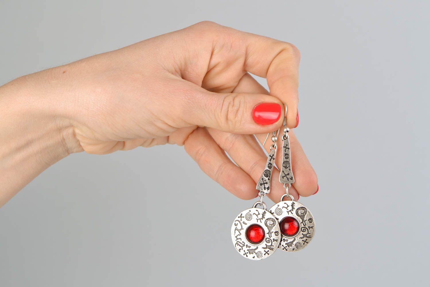 Long metal earrings with red cabochons photo 2