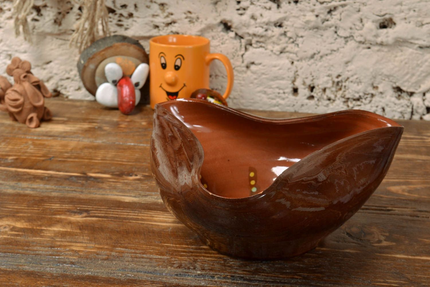 Handmade decorative glazed clay bowl of unusual shape photo 1