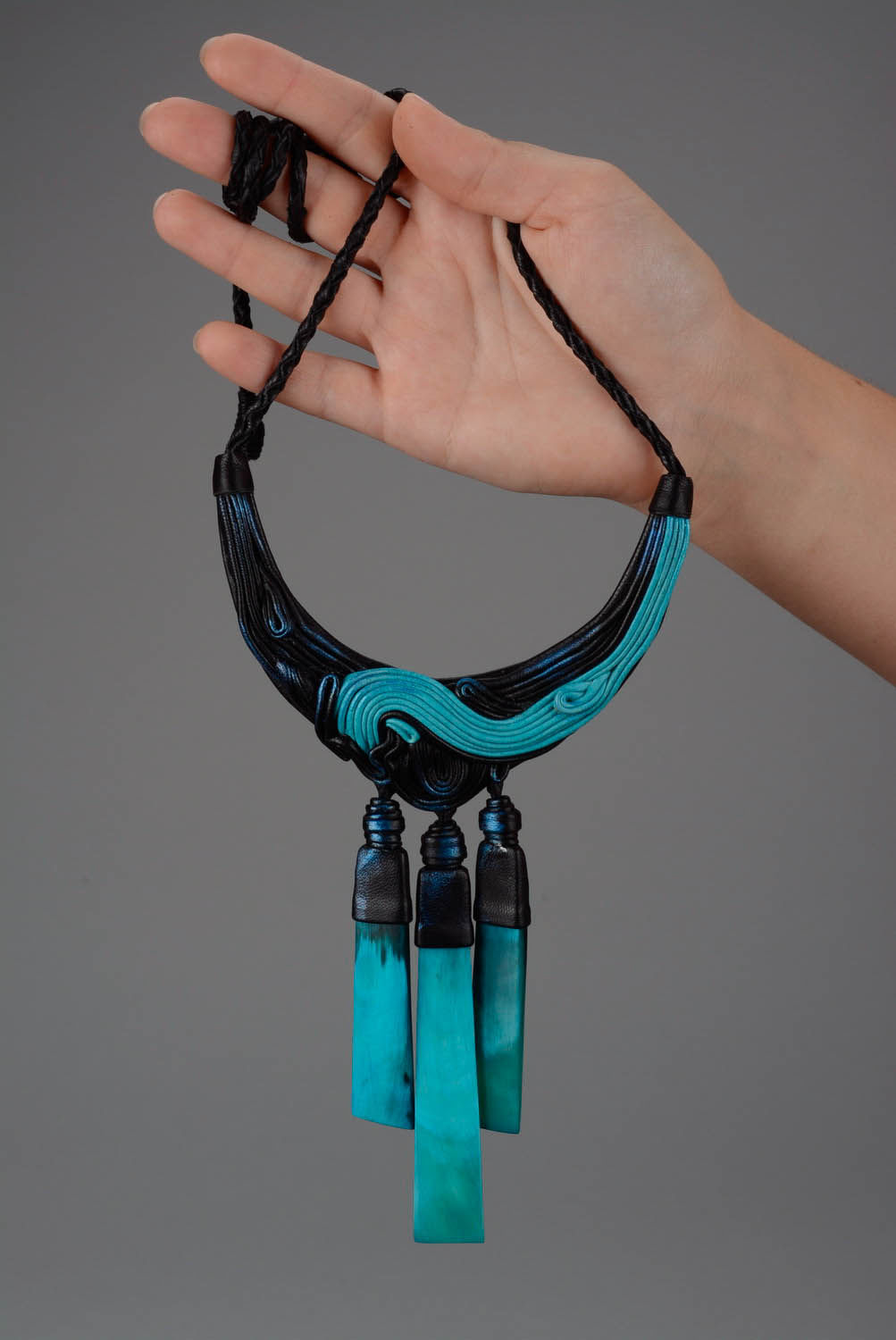 Leather necklace with cow horn photo 5
