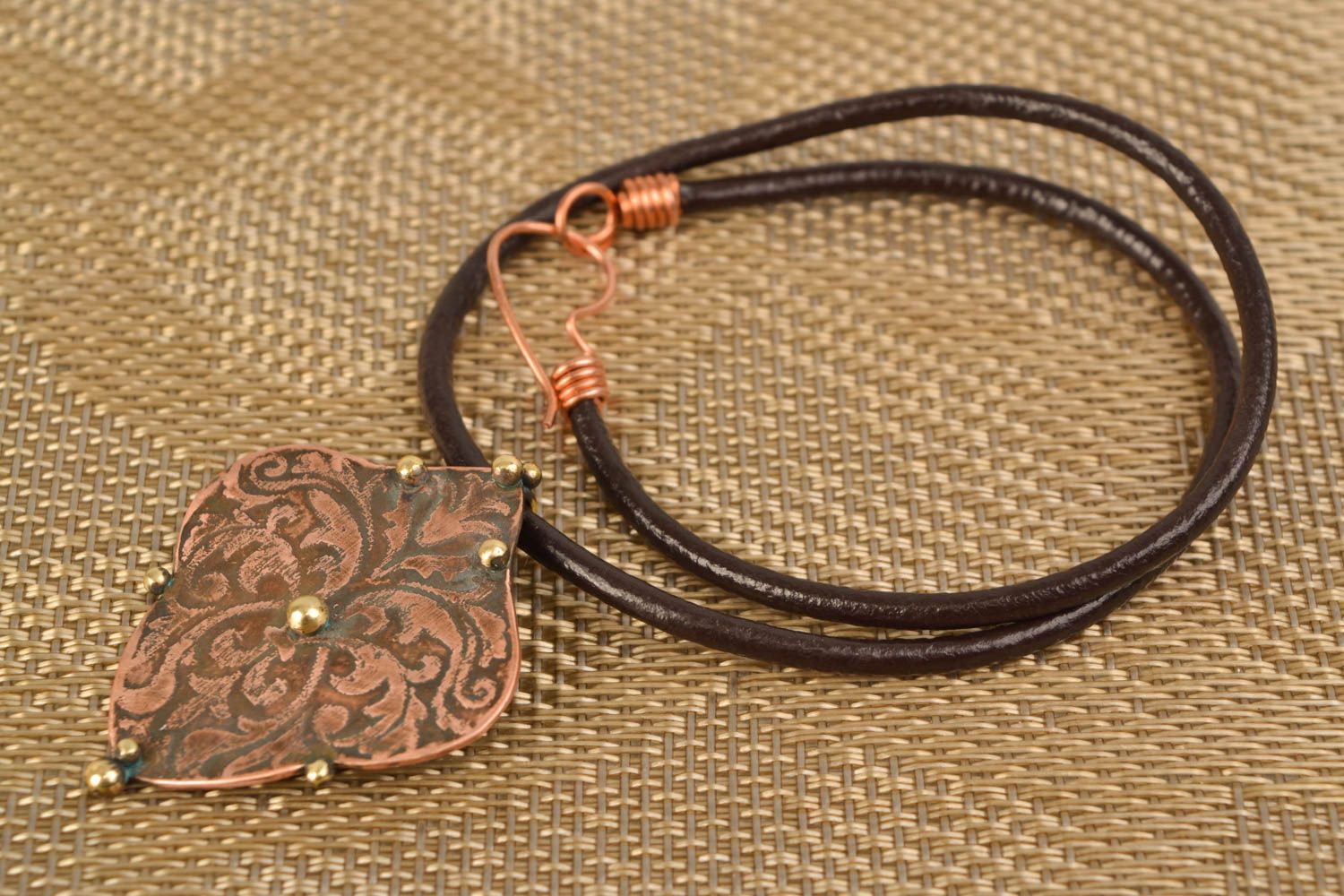 Latten and copper pendant on cord photo 1