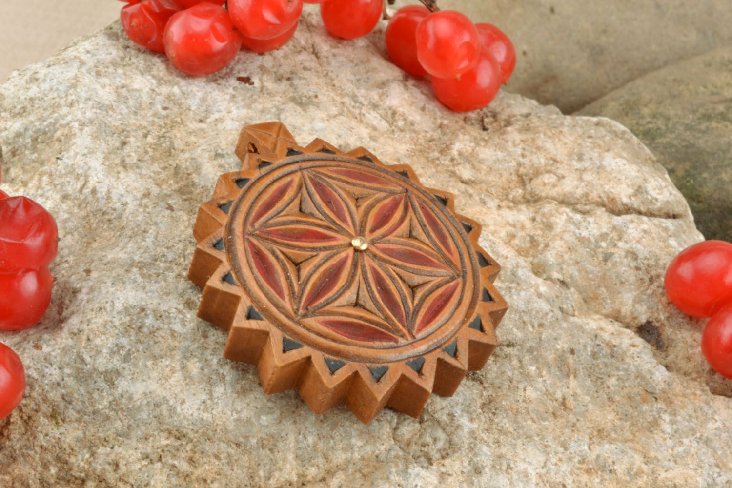 Wooden pendant inlaid with metal inserts photo 1