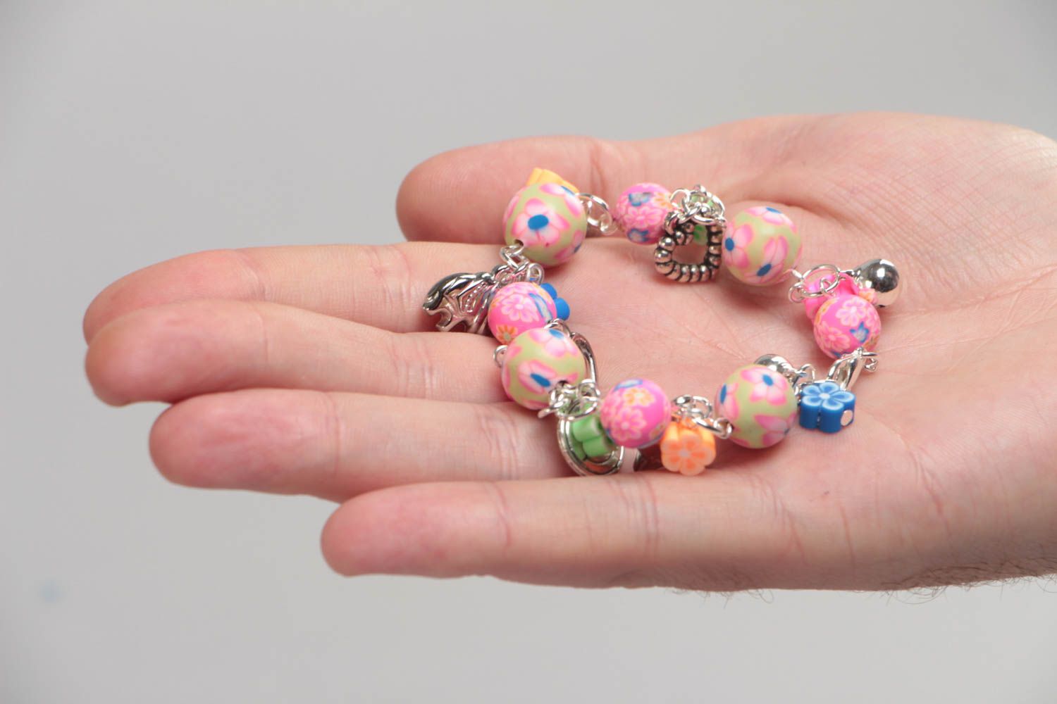 Handmade designer children's pink wrist bracelet with plastic and acrylic beads photo 5