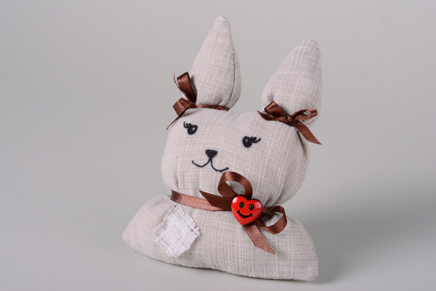 Handmade soft toy sewn of fabric and cotton wool with ribbons Hare photo 1