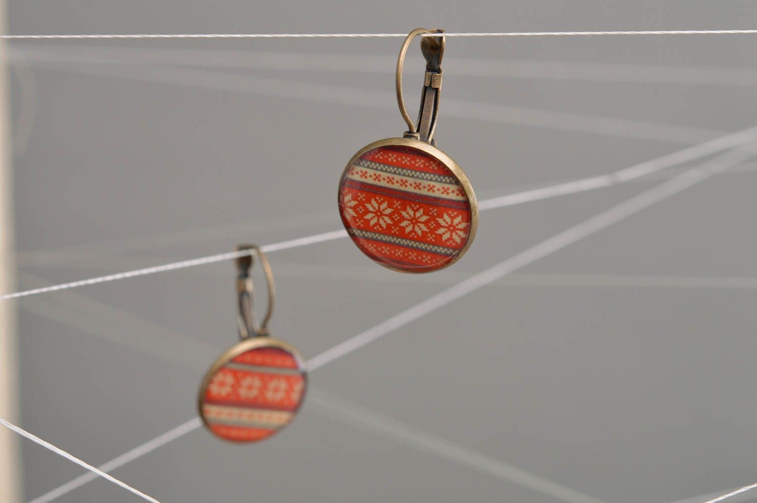 Handmade decoupage round small dangling earrings with red ethnic ornament photo 1