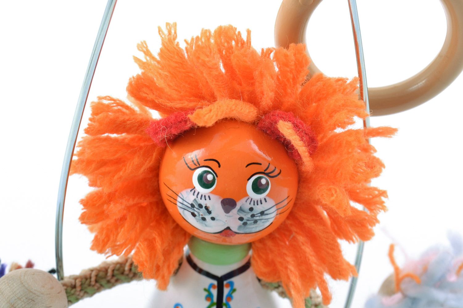 Handmade painted wooden eco toy lion with orange mane on swing photo 3