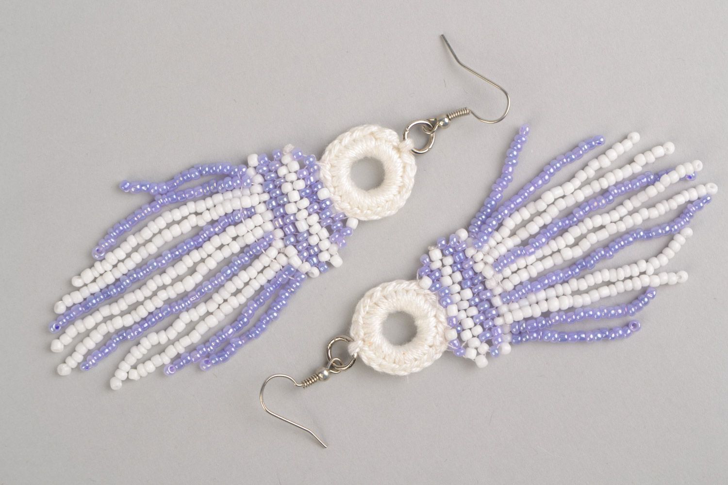 Long handmade earrings with beaded and thread charms of white and purple color photo 2