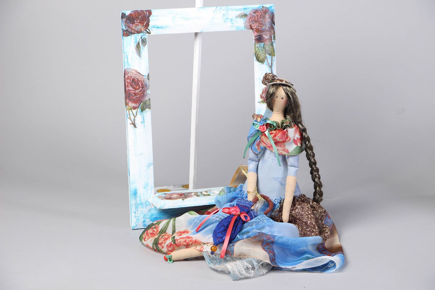 Fabric doll in frame with stand photo 3