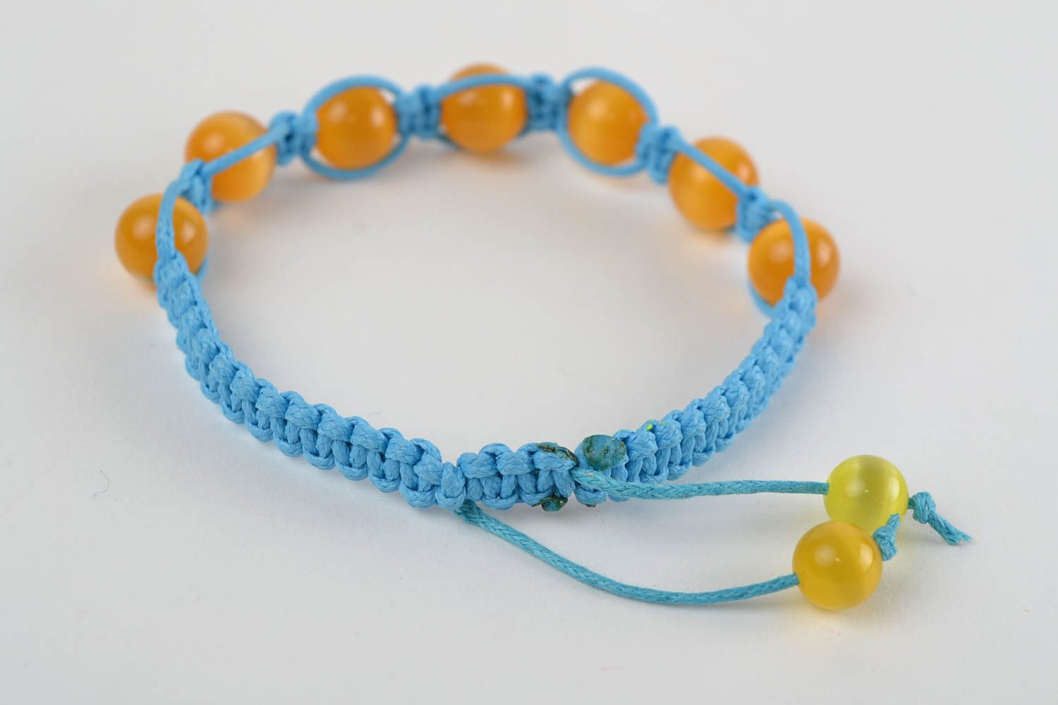 Geflochtenes Armband aus Glas und Schnur blau mit gelb Makramee handgefertigt foto 5