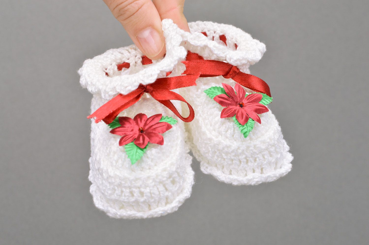Handmade crocheted white baby booties made of cotton with a flower for a baby girl photo 3