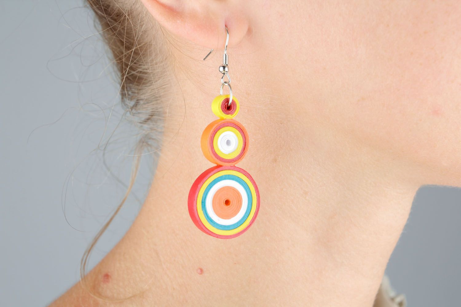Colorful earrings made using quilling technique photo 1