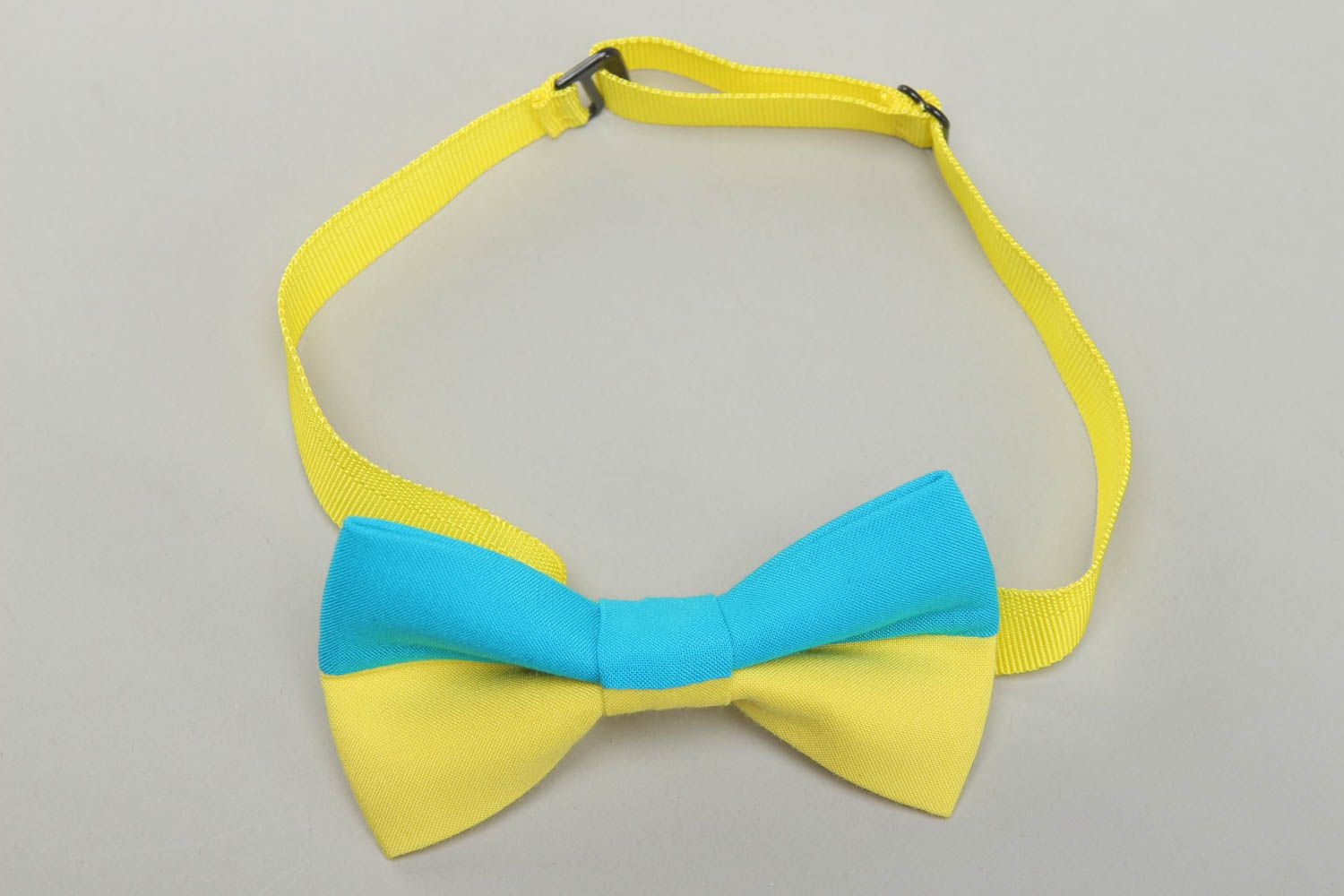 Fabric bow tie of yellow and blue colors photo 1