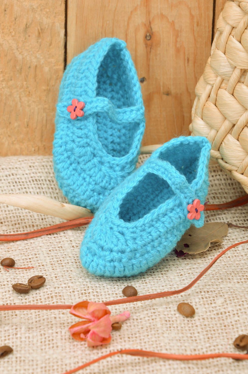 Handcrafted small designer blue baby-shoes made of acrylic yarn with buttons photo 1