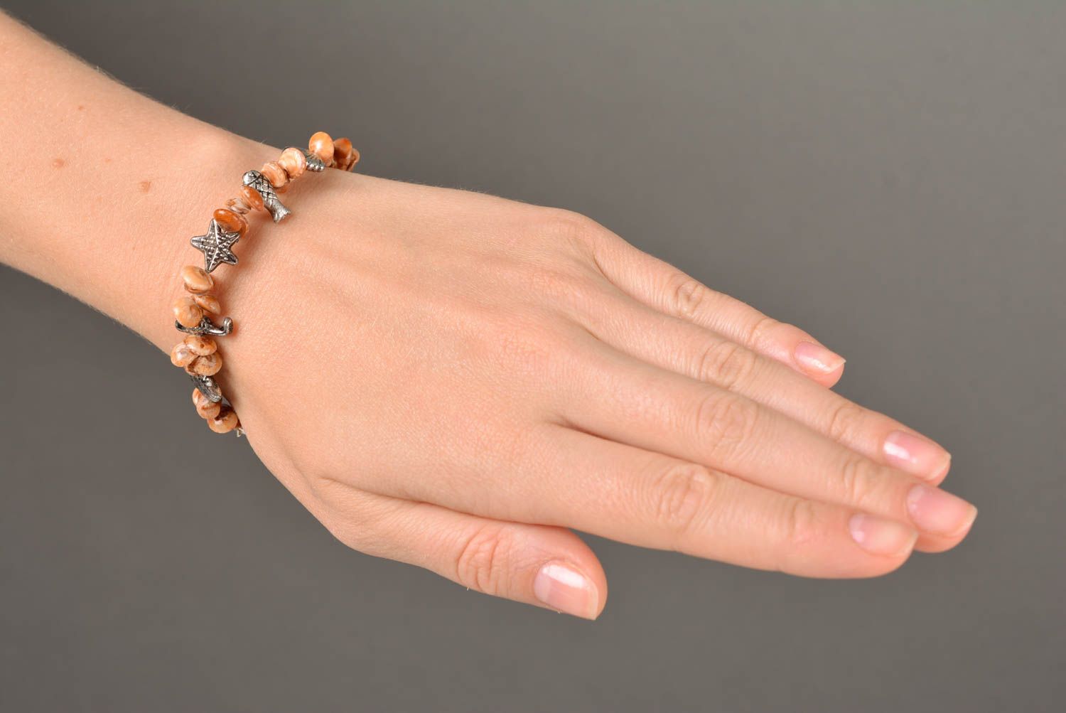 Handmade thin laconic wrist bracelet with seashells and metal charms for women photo 3