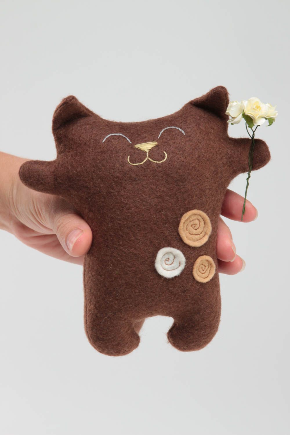 Handmade brown soft small toy made of felt in shape of cat with flowers photo 5