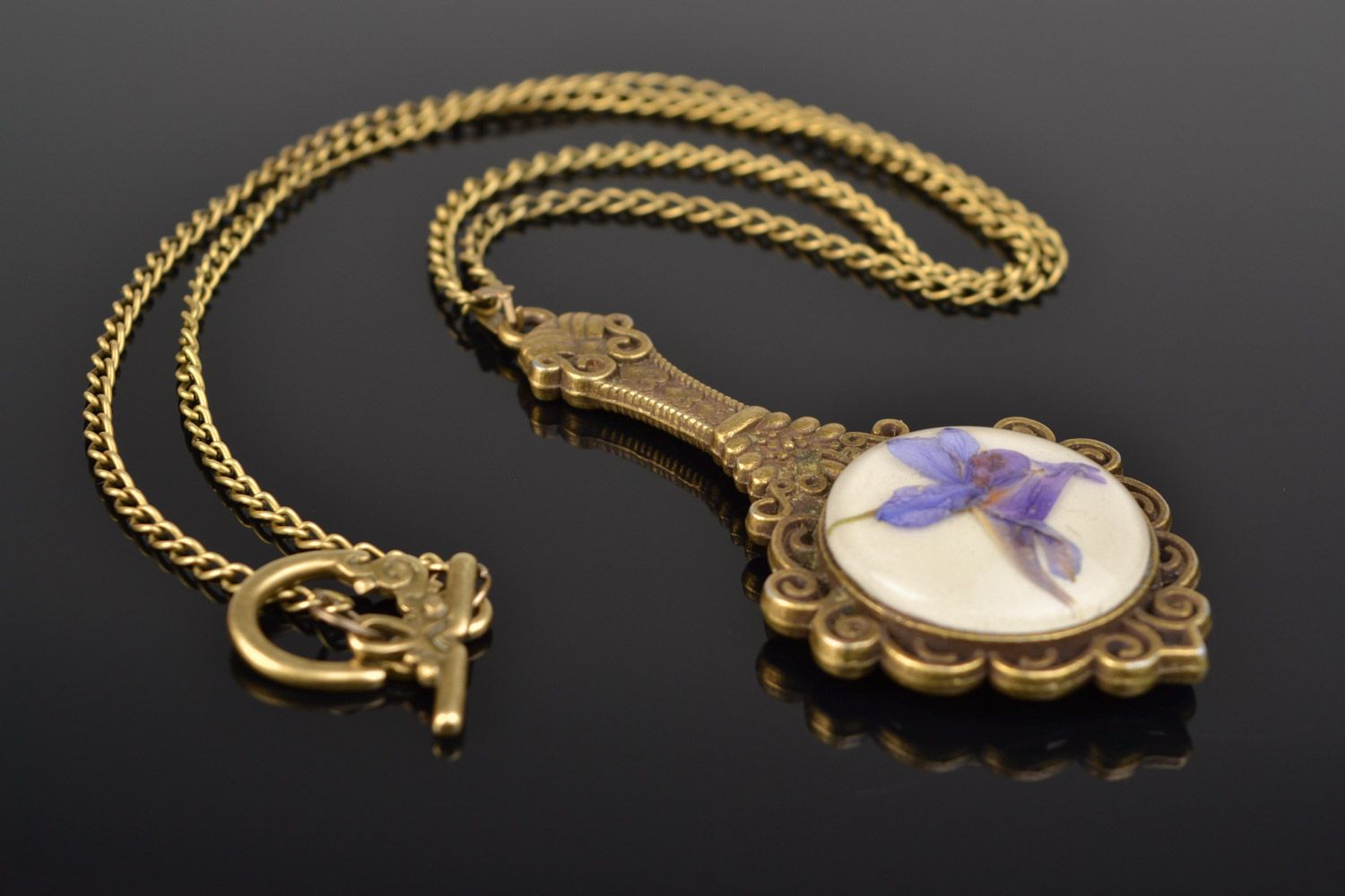 Handmade pendant pocket mirror on long chain with dried flowers coated with epoxy  photo 1