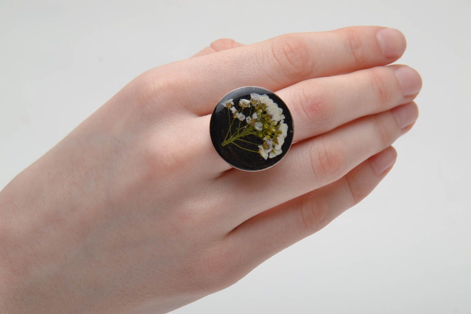 Black ring with natural flower in epoxy resin photo 2