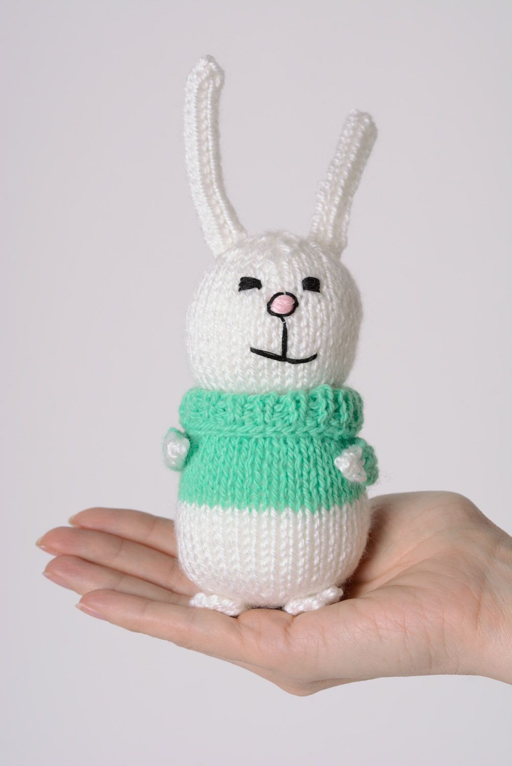 Handmade white knitted soft hare in green sweater photo 4