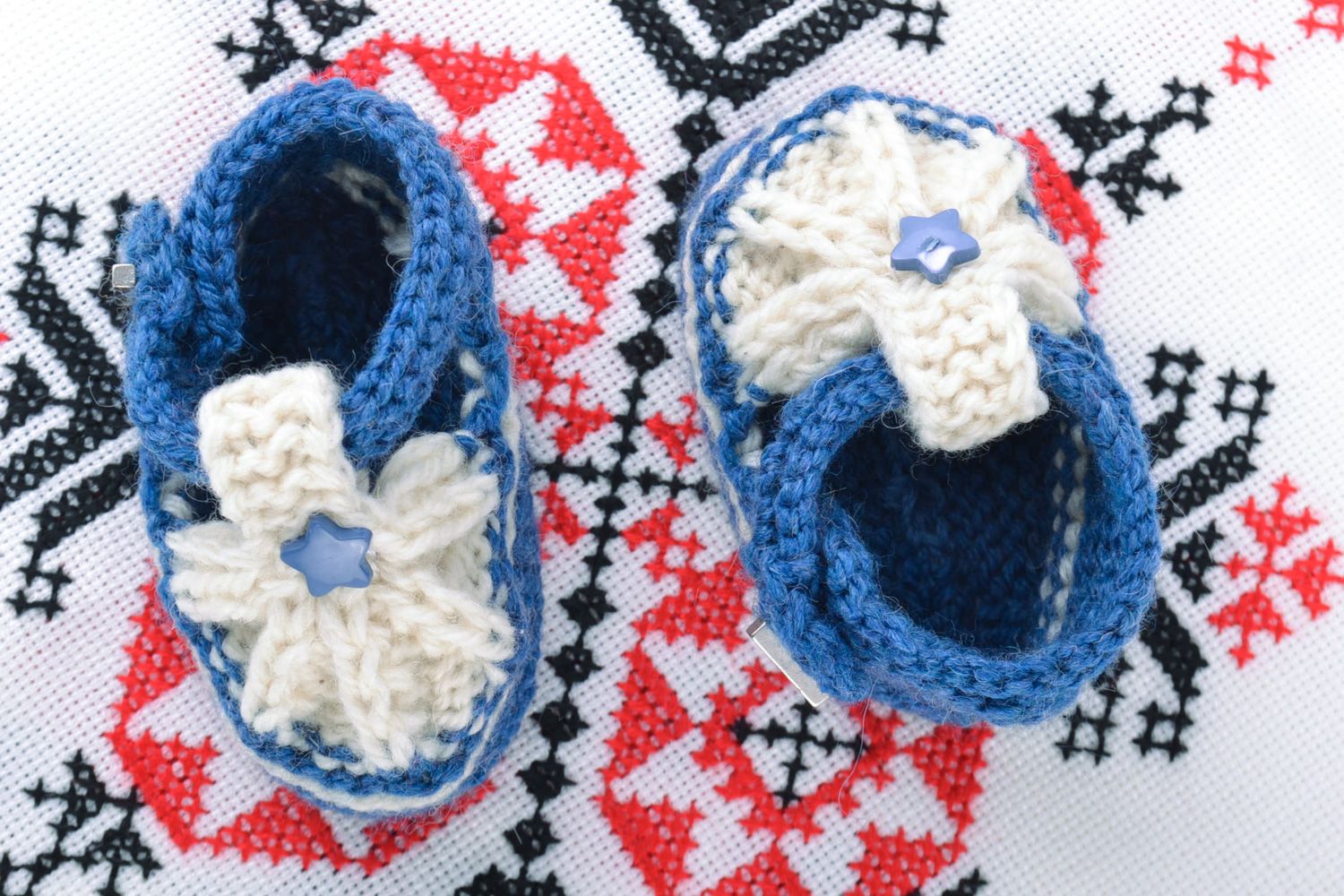 Beautiful small handmade warm baby bootees knitted of natural wool photo 1
