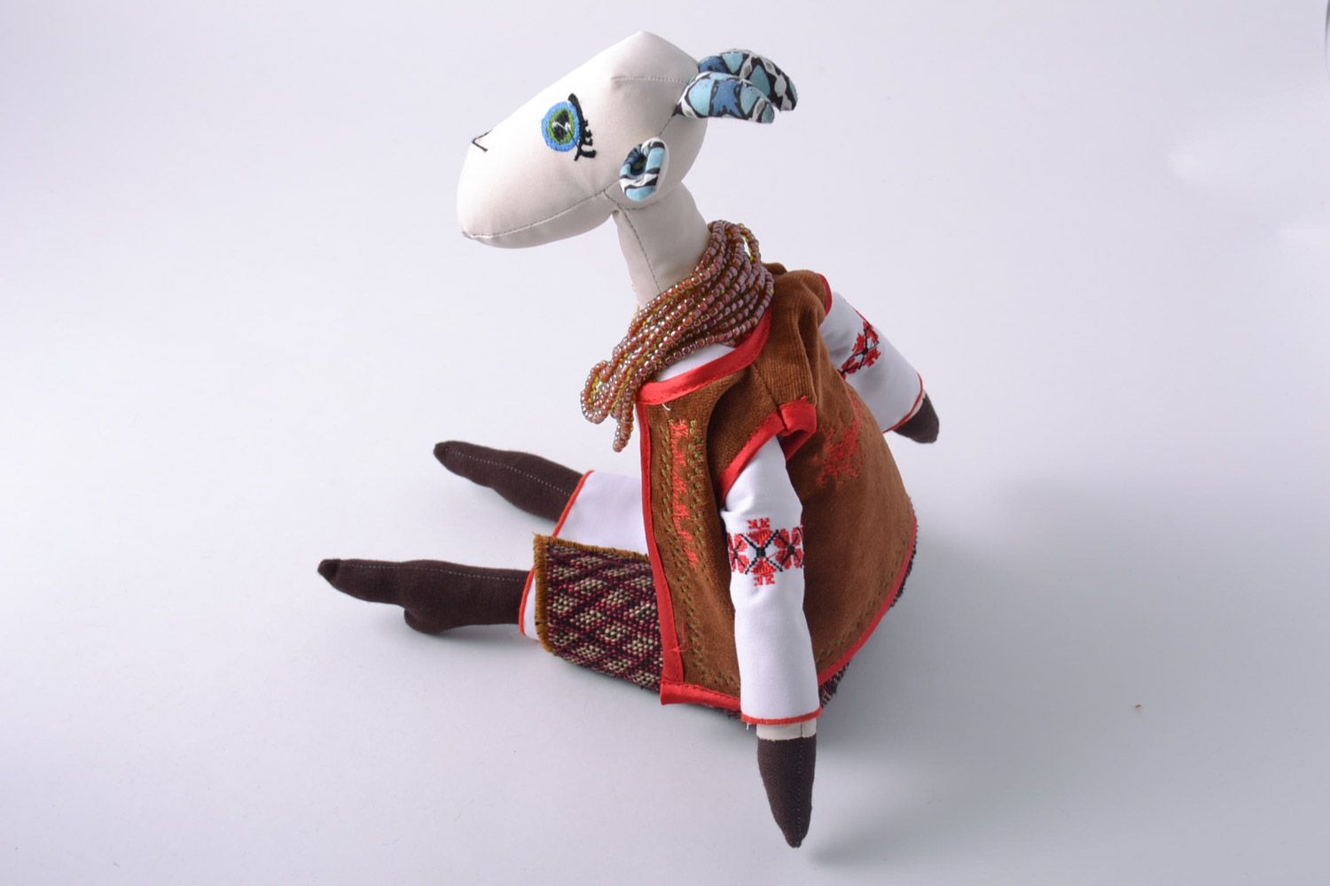 Handmade designer soft toy sewn of fabric tall goat in ethnic clothing photo 4