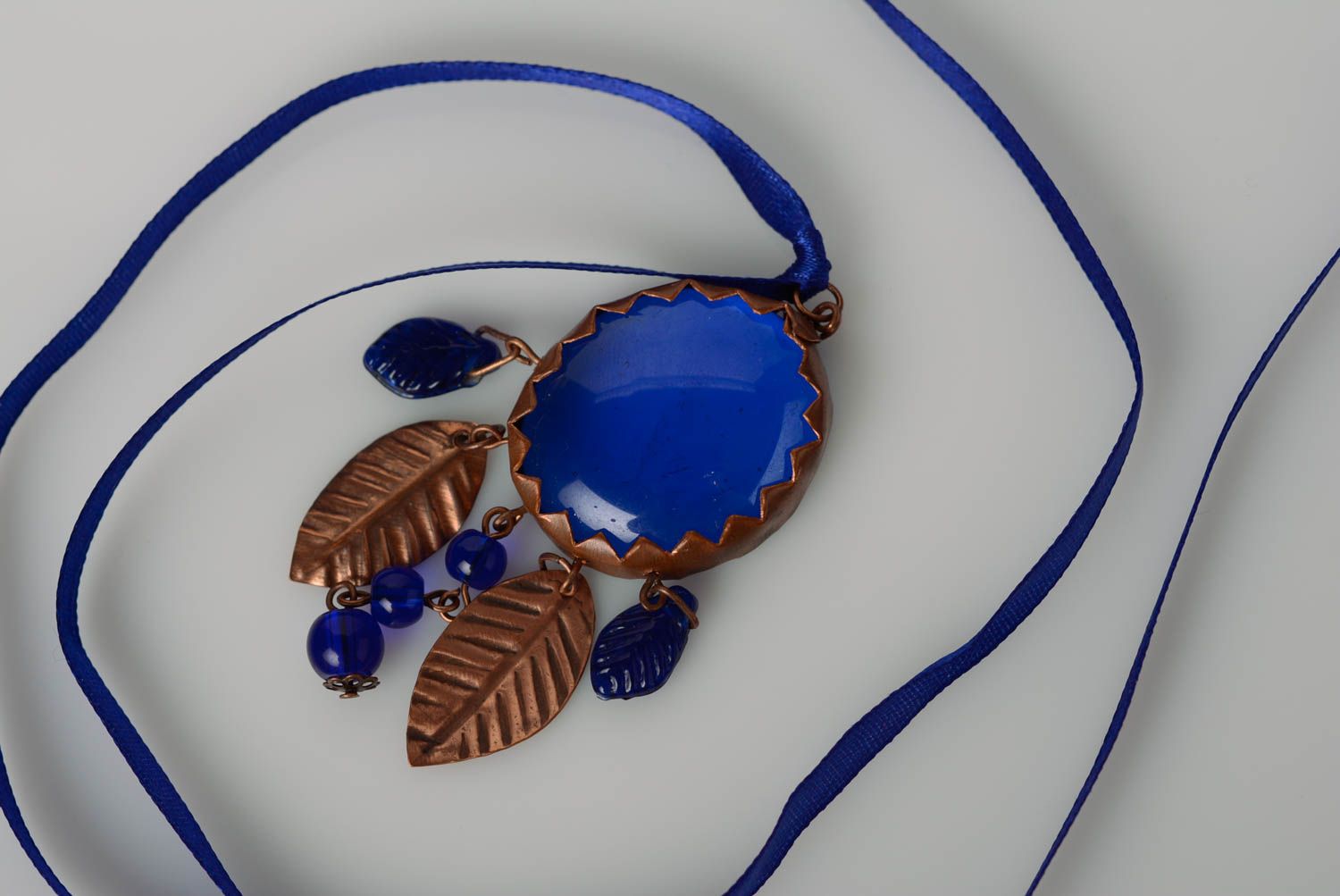 Handmade blue glass and metal pendant with satin ribbon photo 1