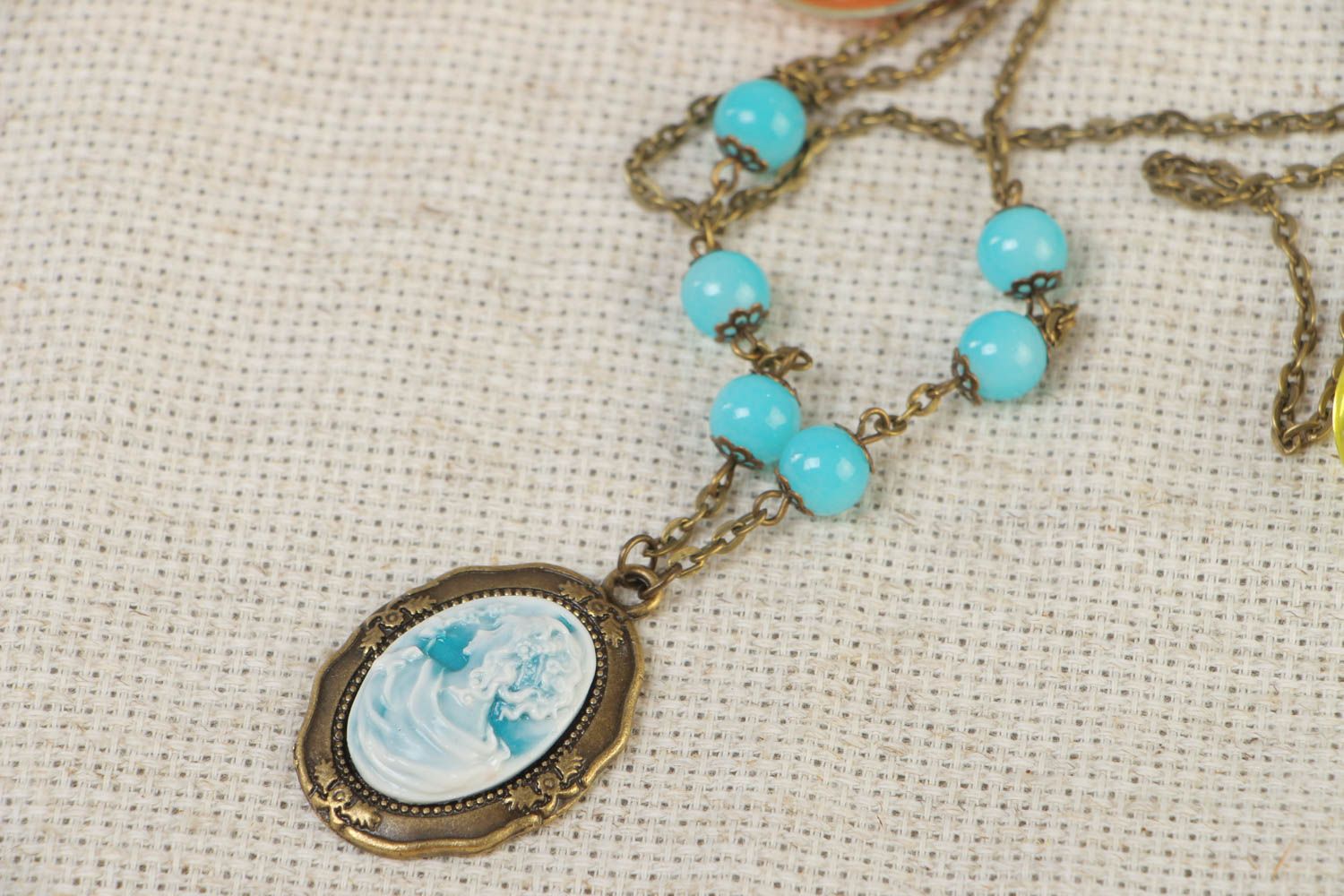 Handmade oval polymer clay pendant on chain with cameo and beads photo 1