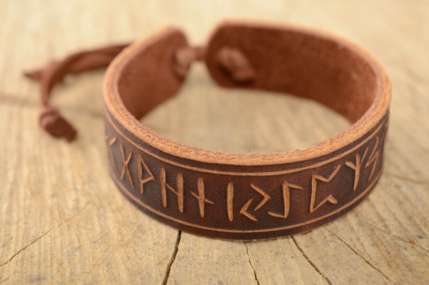 Leather bracelet with runes and ties photo 1