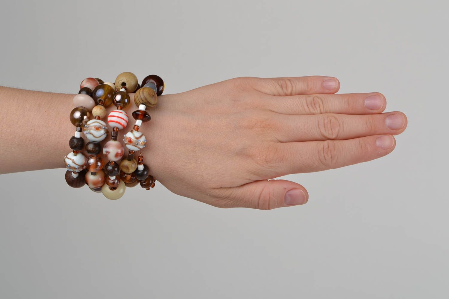 Handmade designer women's wrist bracelet with colorful wooden and glass beads photo 2