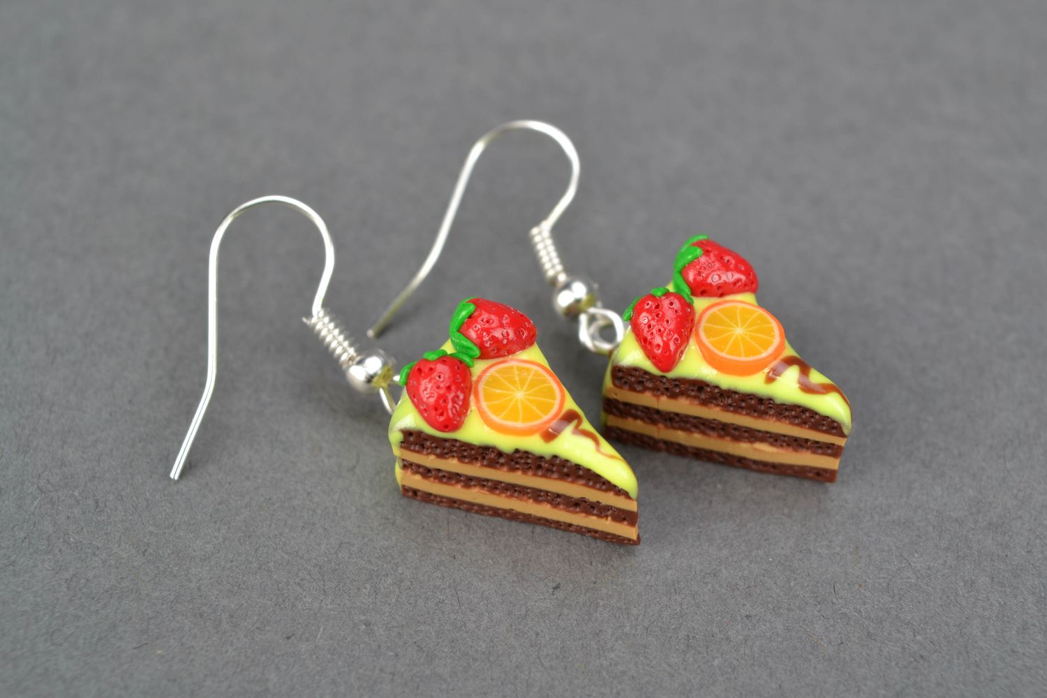 Polymer clay earrings with charms in the shape of orange cake pieces photo 3