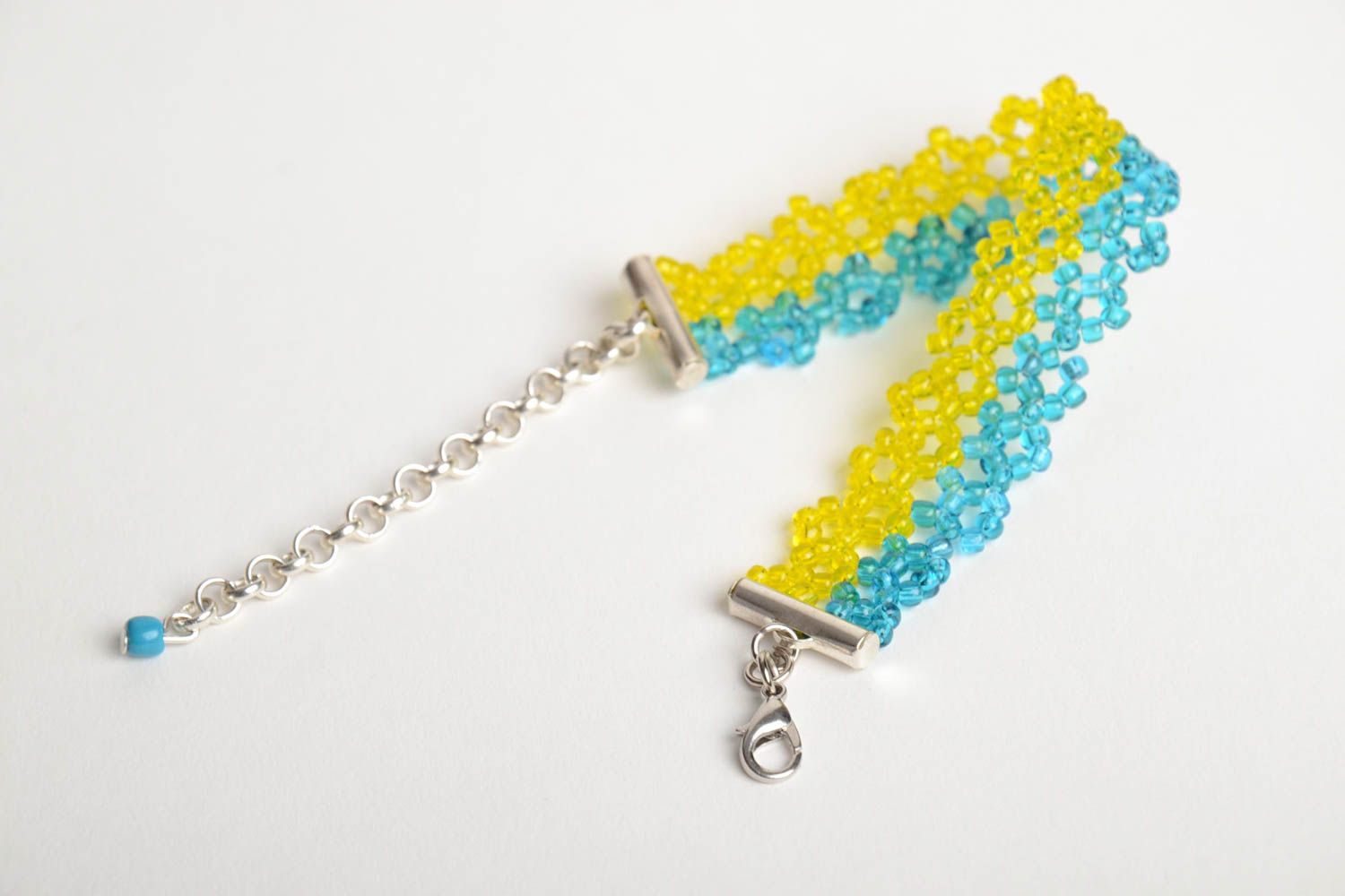 Handmade wrist bracelet crocheted of yellow and blue beads with metal chain photo 4