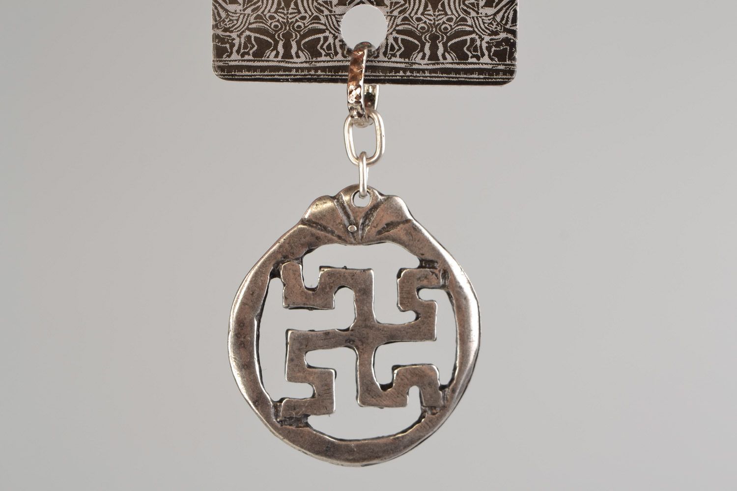 Handmade designer round metal pendant with Slavic symbol in ethnic style  photo 3