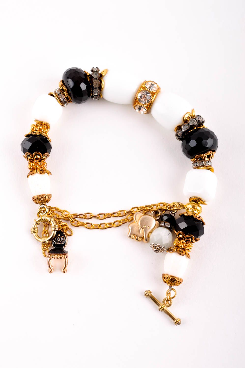 Handmade gemstone beaded bracelet with black and white beads and gold color charms for girls photo 4