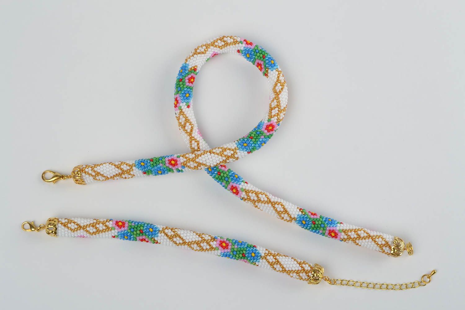 Handmade Schmuckset aus Glasperlen Armband und Collier 2 Stück in Weiß Rot Blau  foto 2