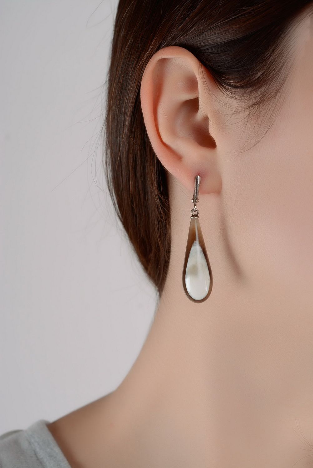 Silver earrings with a cow horn photo 2