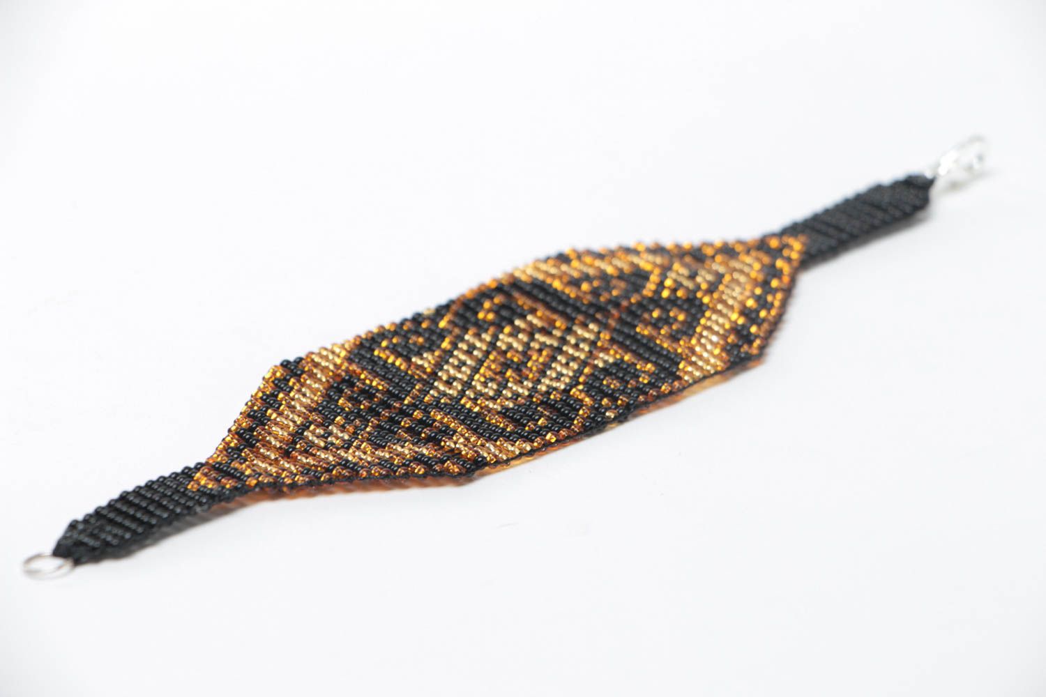 Künstlerisches Armband aus Glasperlen breit mit Ornament von Handarbeit für Dame foto 3
