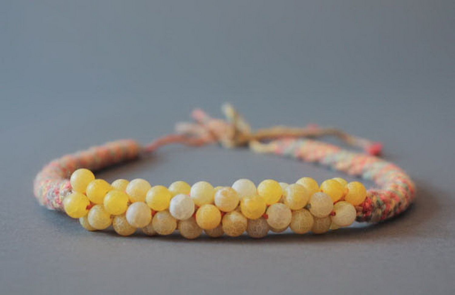 Necklace knitted from cotton with tinted chalcedony beads photo 1