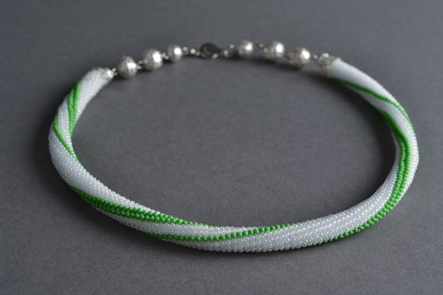 Handmade designer laconic woven beaded cord necklace white and green photo 1