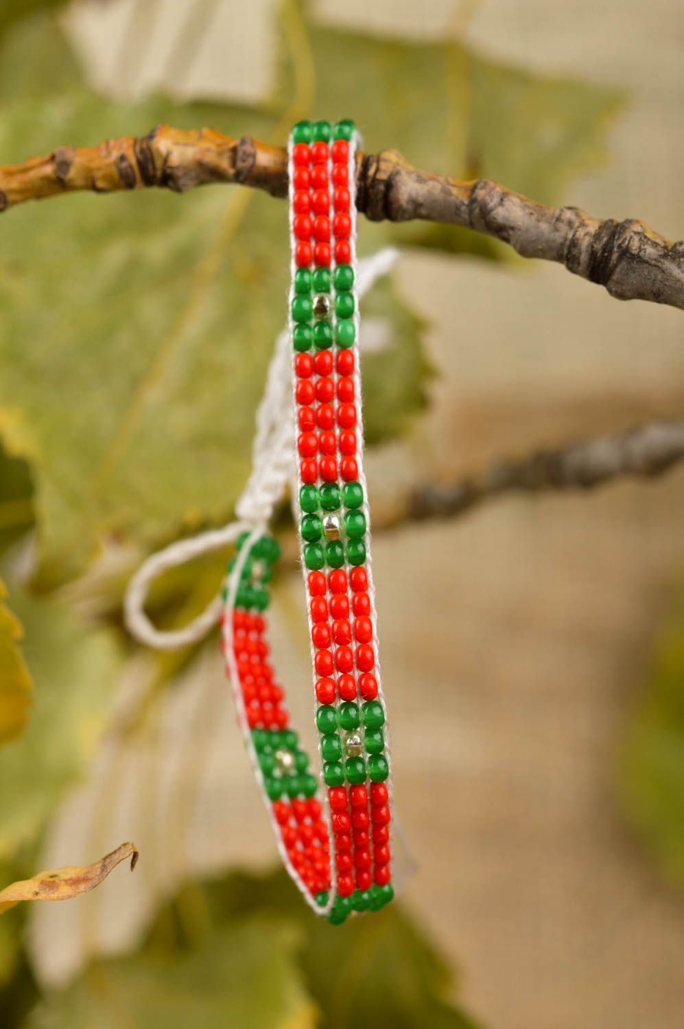 Handmade thin beaded strand bracelet made of red and green beads photo 1