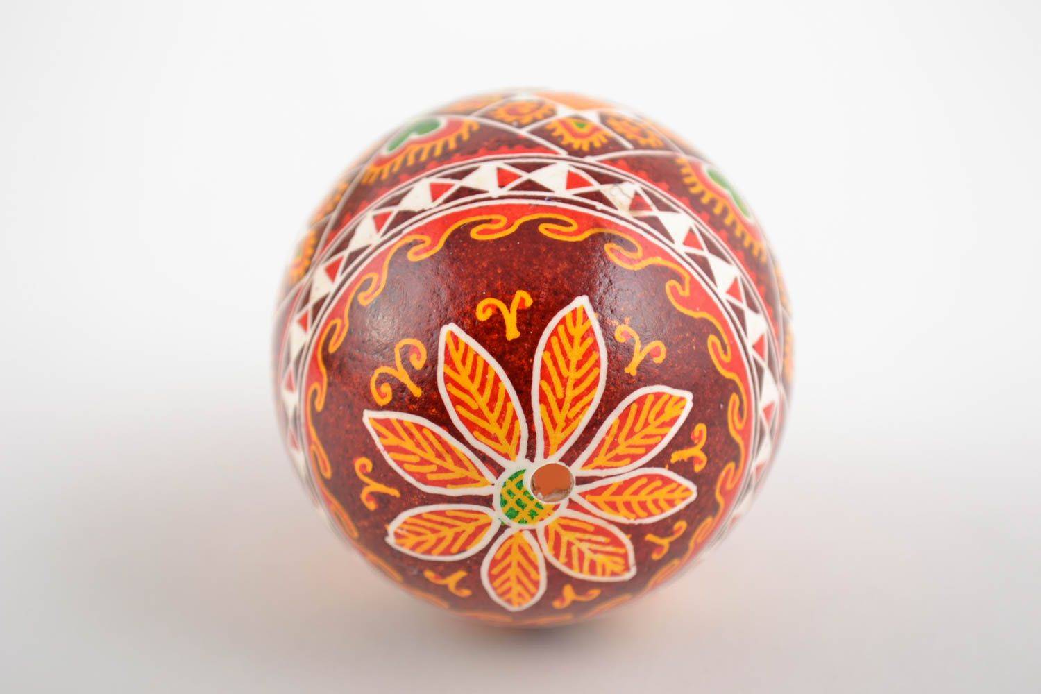 Decorative handmade painted Easter egg with ornament in red color palette photo 5