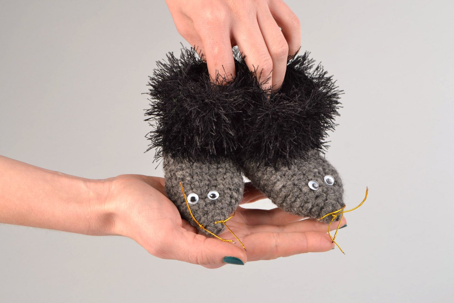 Handmade crochet baby shoes in the shape of gray hedgehogs with black edges photo 2