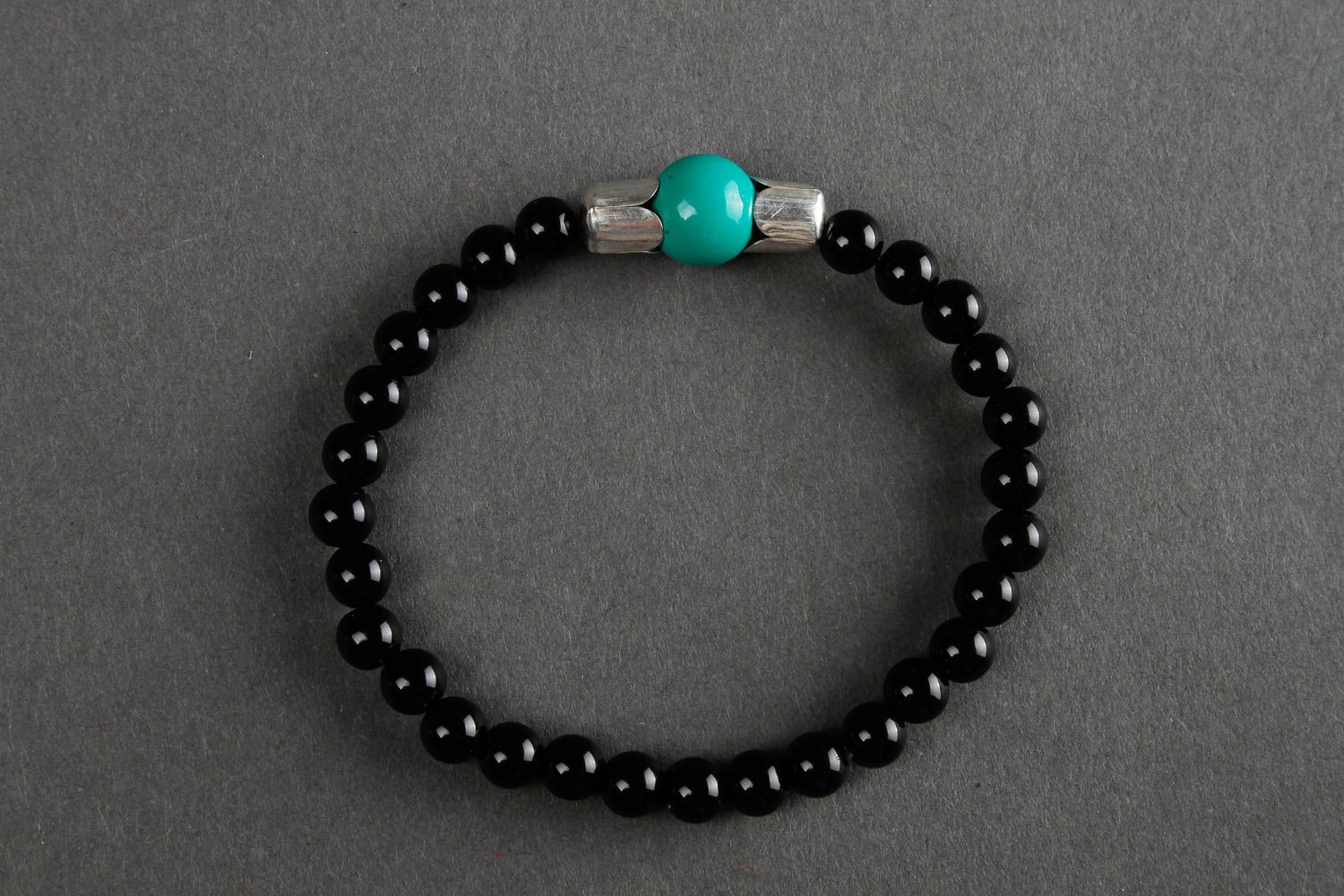 Black beads bracelet on elastic cord and center malachite bead. Unisex bracelet photo 2