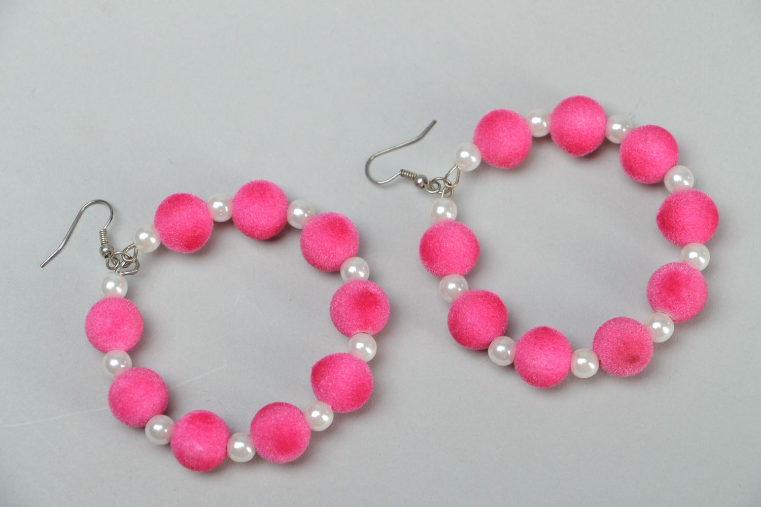 Large hoop earrings of pink color photo 1