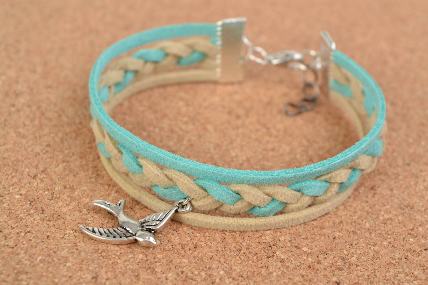 Beautiful handmade woven suede cord bracelet of pastel colors with bird charm photo 1