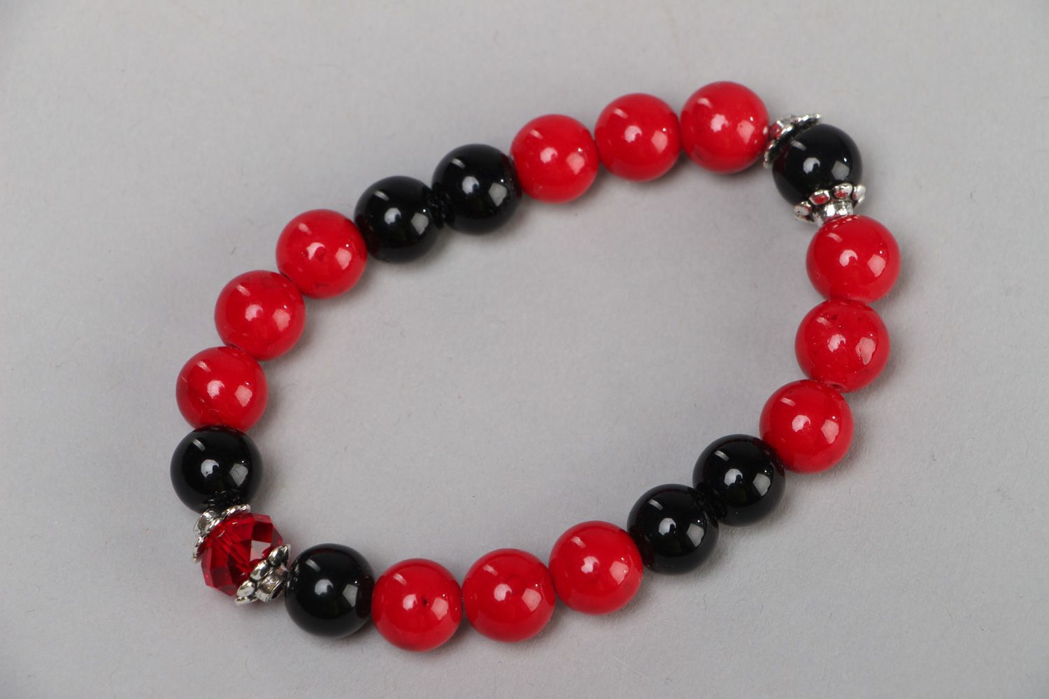 Handmade red and black stretch wrist bracelet with coral and agate stone beads  photo 1